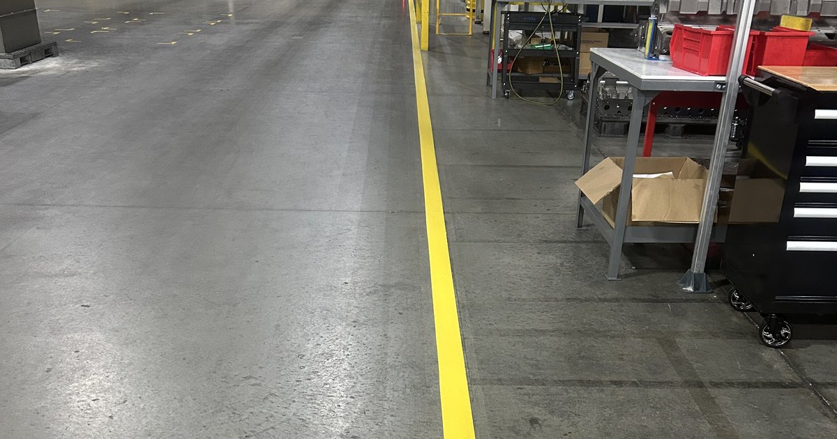 Epoxy-coated manufacturing floor with safety striping, Houston